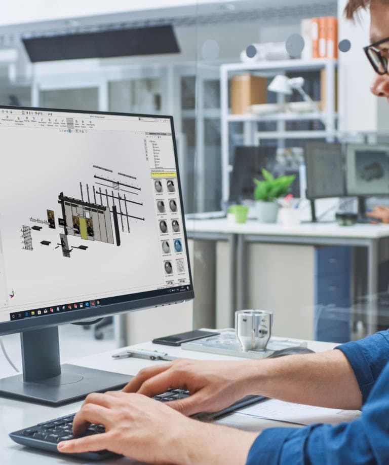 Over the Shoulder Shot of Engineer Working with CAD Software on
